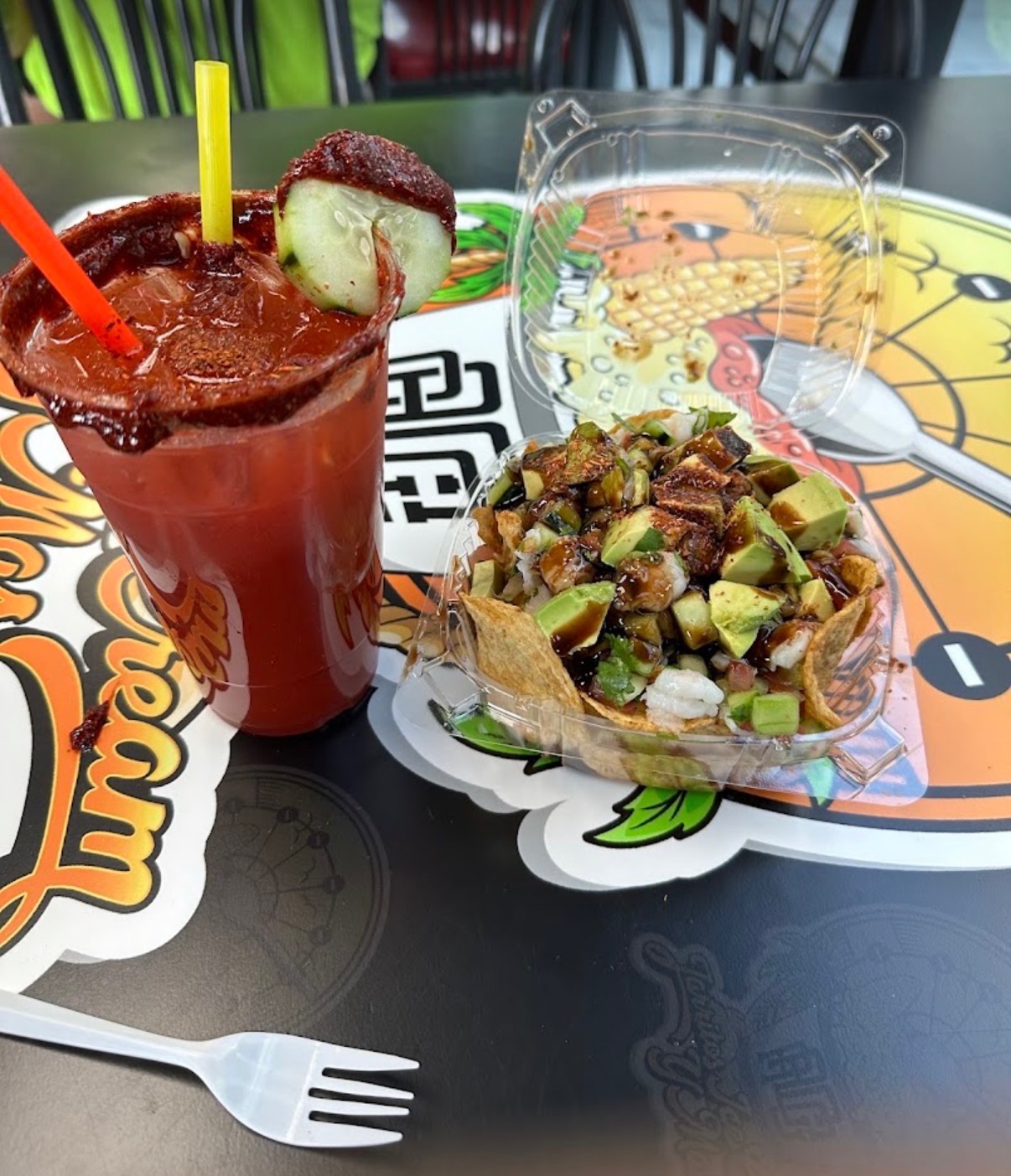 Michelada and avocado-topped antojito served at Jarritos Tropico