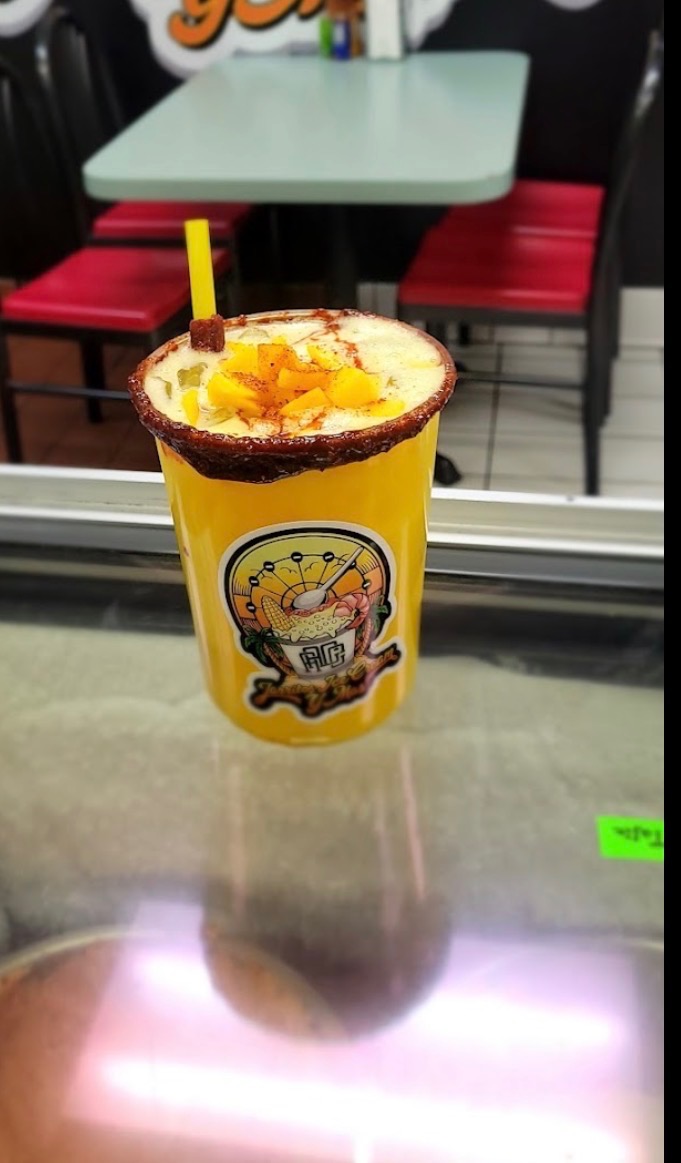 Mango drink topped with fresh mango and chile